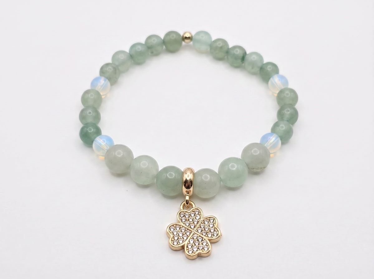 Green Aventurine and Opalite Four-Leaf Clover Charm Bracelet flat lay on white background