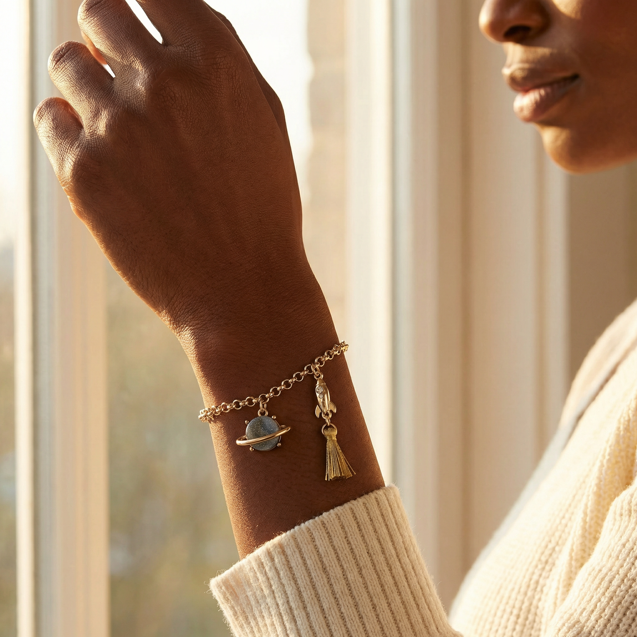 Space Charm Bracelet on Model - Wrist Close-up by Window