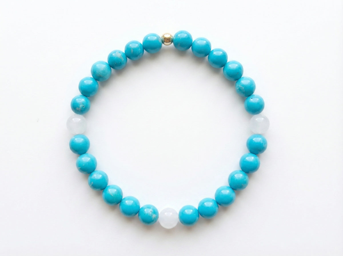 Turquoise and White Jade Bead Bracelet flat lay on white background